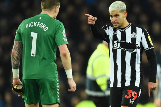 Newcastle United midfielder Bruno Guimaraes remonstrates with Everton goalkeeper Jordan Pickford after his side's 3-0 loss to Everton. (Photo by PETER POWELL/AFP via Getty Images)