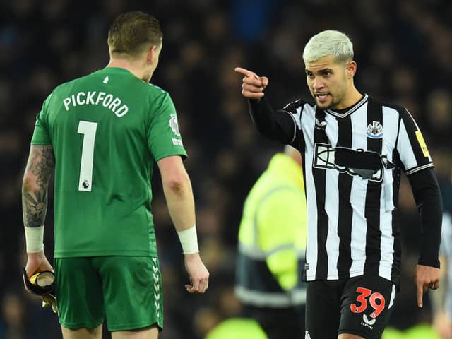 Newcastle United midfielder Bruno Guimaraes remonstrates with Everton goalkeeper Jordan Pickford after his side's 3-0 loss to Everton. (Photo by PETER POWELL/AFP via Getty Images)