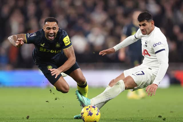 Newcastle United striker Callum Wilson is challenged by Cristian Romero. (Photo by Julian Finney/Getty Images)