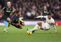 Callum Wilson of Newcastle United clashes with Cristian Romero of Tottenham Hotspur during the Premier League match between Tottenham Hotspur and Newcastle United at Tottenham Hotspur Stadium on December 10, 2023 in London, England. (Photo by Julian Finney/Getty Images)