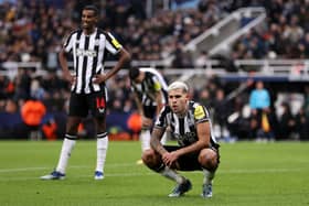 Bruno Guimaraes of Newcastle United looks dejected after the team's defeat in the UEFA Champions League match between Newcastle United FC and AC Milan at St. James Park on December 13, 2023 in Newcastle upon Tyne, England. (Photo by Michael Steele/Getty Images)