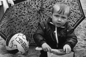 Kenneth Rickenton was sheltering under the umbrella from the poor weather in South Tyneside in August 1985.