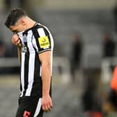Fabian Schar of Newcastle United looks dejected after the team's defeat in the UEFA Champions League match between Newcastle United FC and AC Milan at St. James Park on December 13, 2023 in Newcastle upon Tyne, England. (Photo by Stu Forster/Getty Images)