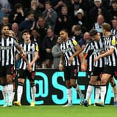 Newcastle United celebrate scoring at Stamford Bridge against Chelsea in the Carabao Cup quarter-final. 