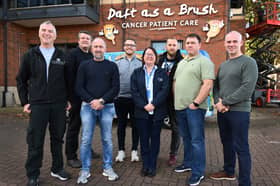 Directors from Barratt Developments North East volunteering for its Charity Of The Year Daft as a Brush