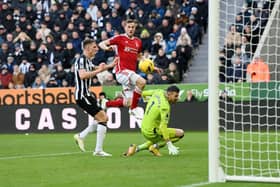 Chris Wood of Nottingham Forest scores their sides second goal past Martin Dubravka of Newcastle United during the Premier League match between Newcastle United and Nottingham Forest at St. James Park on December 26, 2023 in Newcastle upon Tyne, England. (Photo by Stu Forster/Getty Images)