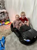 Layla and Elijah in a new car