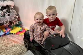 Layla and Elijah in a new car