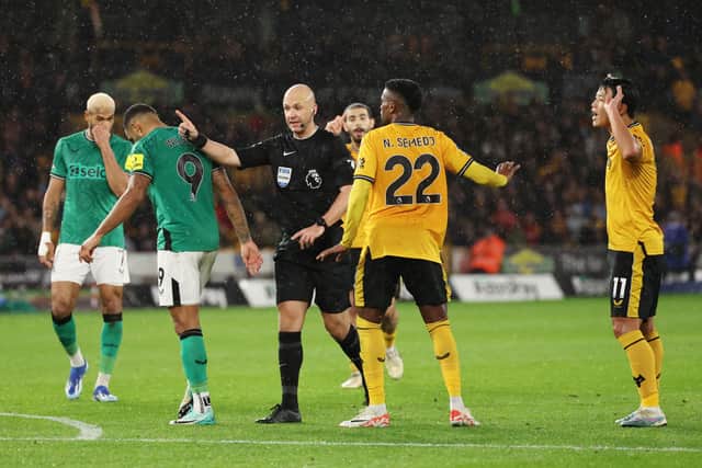 Referee Anthony Taylor awards Newcastle United a penalty kick during the Premier League match with Wolves. (Photo by Matt McNulty/Getty Images)