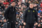 Newcastle United's English head coach Eddie Howe (R) and Newcastle United's assistant coach Jason Tindall (L) look on during the English Premier League football match between Liverpool and Newcastle United at Anfield in Liverpool, north west England on January 1, 2024. (Photo by PETER POWELL / AFP)