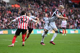 Trai Hume of Sunderland pulls the shirt of Anthony Gordon of Newcastle United during the Emirates FA Cup Third Round match between Sunderland and Newcastle United at Stadium of Light on January 06, 2024 in Sunderland, England. (Photo by Stu Forster/Getty Images)