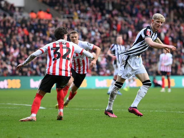Trai Hume of Sunderland pulls the shirt of Anthony Gordon of Newcastle United during the Emirates FA Cup Third Round match between Sunderland and Newcastle United at Stadium of Light on January 06, 2024 in Sunderland, England. (Photo by Stu Forster/Getty Images)