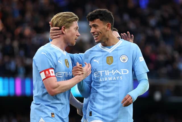Kevin De Bruyne and Matheus Nunes of Manchester City celebrate after teammate Jeremy Doku (not pictured) scores their team's fifth goal during the Emirates FA Cup Third Round match between Manchester City and Huddersfield Town at Etihad Stadium on January 07, 2024 in Manchester, England. (Photo by Clive Brunskill/Getty Images)
