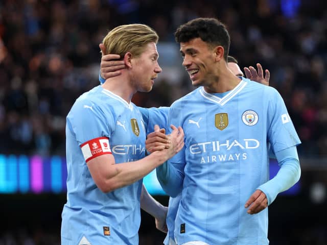 Kevin De Bruyne and Matheus Nunes of Manchester City celebrate after teammate Jeremy Doku (not pictured) scores their team's fifth goal during the Emirates FA Cup Third Round match between Manchester City and Huddersfield Town at Etihad Stadium on January 07, 2024 in Manchester, England. (Photo by Clive Brunskill/Getty Images)