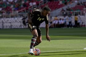  Dujuan Richards of Jamaica dribbling the ball gains control against Saint Kitts and Nevis. (Photo by Thearon W. Henderson/Getty Images)