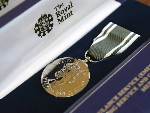 Ambulance workers receive Queen’s Medal for their contribution to emergency services