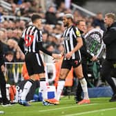 Joelinton of Newcastle United (R) reacts as he is substituted off injured for teammate Lewis Miley during the Premier League match between Newcastle United and Fulham FC at St. James Park on December 16, 2023 in Newcastle upon Tyne, England. (Photo by Stu Forster/Getty Images)