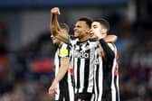 Jacob Murphy of Newcastle United celebrates with Miguel Almiron of Newcastle United after scoring his team's third goal during the Premier League match between Aston Villa and Newcastle United at Villa Park on January 30, 2024 in Birmingham, England. (Photo by Catherine Ivill/Getty Images)