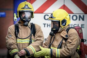 Firefighters wearing Breathing Apparatus equipment.