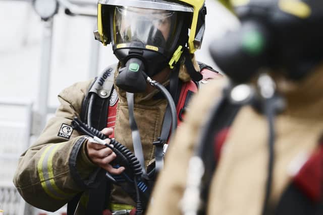 Firefighters wearing Breathing Apparatus equipment.
