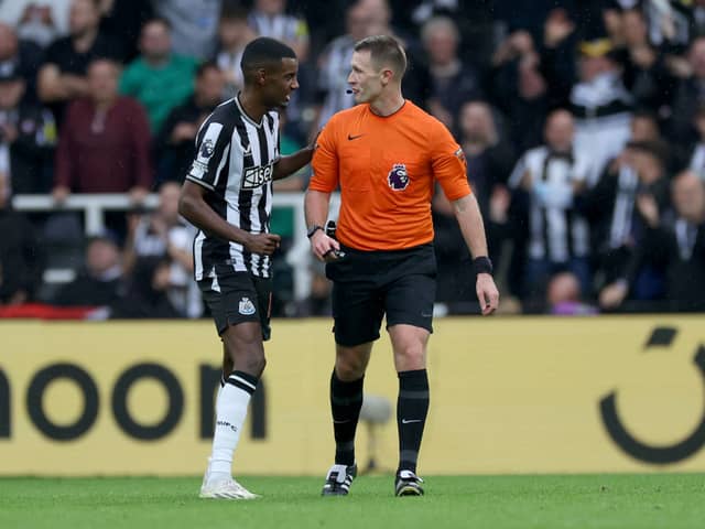 Alexander Isak of Newcastle United speaks to Referee, Thomas Bramall during the Premier League match between Newcastle United and Burnley FC, (Photo by Ian MacNicol/Getty Images)