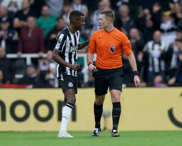 Alexander Isak of Newcastle United speaks to Referee, Thomas Bramall during the Premier League match between Newcastle United and Burnley FC, (Photo by Ian MacNicol/Getty Images)