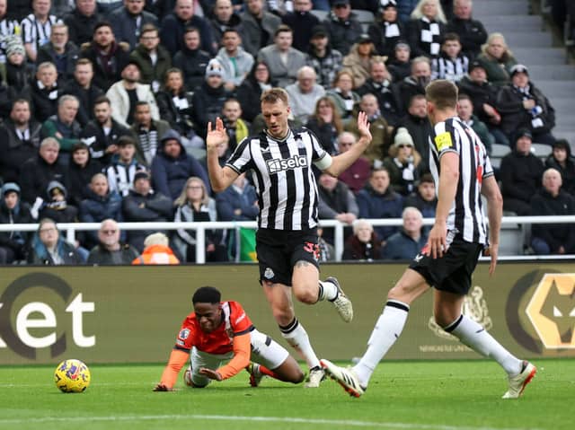 Newcastle United defender Dan Burn concedes a penalty against Luton Town. (Photo by George Wood/Getty Images)
