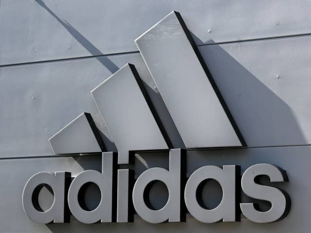 The company logo of Germany's sports equipment maker Adidas is seen on a building in Herzogenaurach, southern Germany, on July 3, 2023. (Photo by Christof STACHE / AFP) 