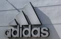 The company logo of Germany's sports equipment maker Adidas is seen on a building in Herzogenaurach, southern Germany, on July 3, 2023. (Photo by Christof STACHE / AFP) 