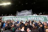 Fans of Newcastle United hold up banners reading 'Tv Before Fans' and 'Green Football Weekend' during the Premier League match between Newcastle United and Luton Town at St. James Park on February 03, 2024 in Newcastle upon Tyne, England. (Photo by Matt McNulty/Getty Images)