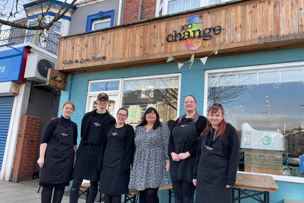 Sarah Farrell-Forster (middle) with the Sea Change staff team.