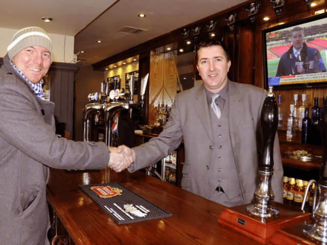 The Ship and Royal pub in Ocean Road, South Shields. Manager Stan Mckeith greets one of his regular customers. Who can tell us more? 