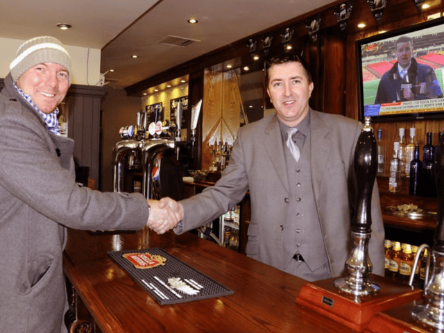 The Ship and Royal pub in Ocean Road, South Shields. Manager Stan Mckeith greets one of his regular customers. Who can tell us more? 