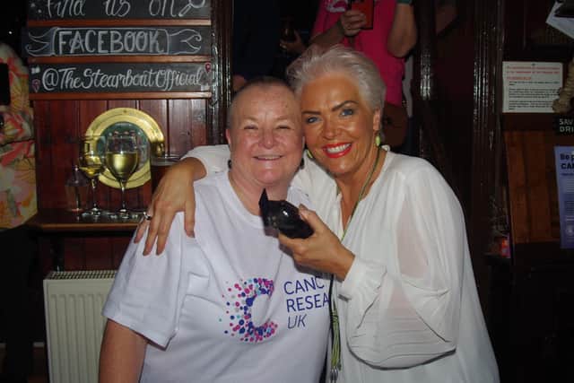 Janet after the head shave with Georgia Johnson

Credit: Paul Dix