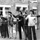 Practising pancake flips before the annual race organised by Hyde Street Venture Group in 1980. Who do you recognise in this photo? 