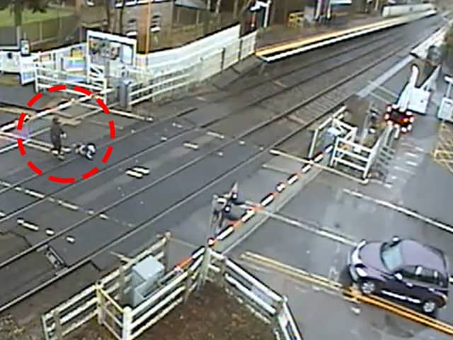 A dogwalker dodged death by crossing a railway and forcing a train to make an emergency stop Picture: Network Rail / SWNS