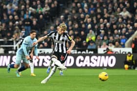 Anthony Gordon of Newcastle United scores his team's first goal from the penalty spot during the Premier League match between Newcastle United and AFC Bournemouth at St. James Park on February 17, 2024 in Newcastle upon Tyne, England. (Photo by Stu Forster/Getty Images)