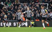 Bruno Guimaraes and Joe White of Newcastle United celebrate Matt Ritchie of Newcastle United (not pictured) scores second goal during the Premier League match between Newcastle United and AFC Bournemouth at St. James Park on February 17, 2024 in Newcastle upon Tyne, England. (Photo by George Wood/Getty Images)