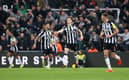 Bruno Guimaraes and Joe White of Newcastle United celebrate Matt Ritchie of Newcastle United (not pictured) scores second goal. (Photo by George Wood/Getty Images)