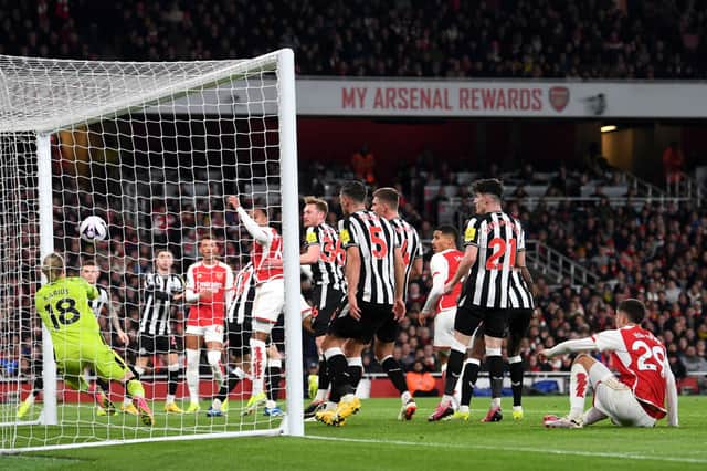 Gabriel of Arsenal heads a shot which is later deflected by Sven Botman of Newcastle United, resulting in an own-goal and Arsenal's first goal during the Premier League match between Arsenal FC and Newcastle United at Emirates Stadium on February 24, 2024 in London, England. (Photo by David Price/Arsenal FC via Getty Images)