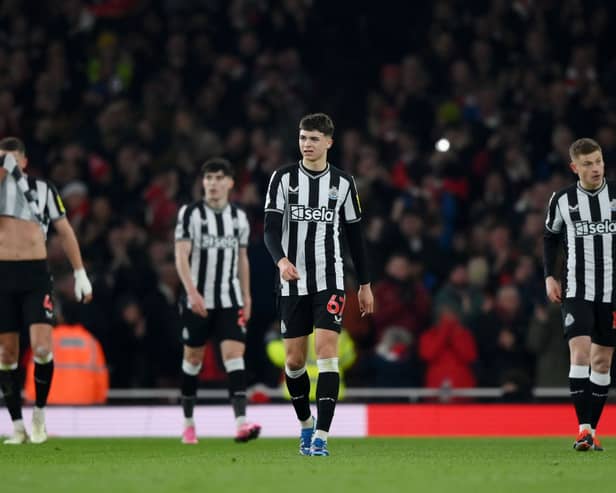 Lewis Miley of Newcastle United looks dejected after Bukayo Saka of Arsenal (not pictured) scores his team's third goal during the Premier League match between Arsenal FC and Newcastle United at Emirates Stadium on February 24, 2024 in London, England. (Photo by Justin Setterfield/Getty Images)