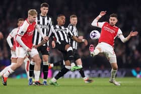 Joe Willock of Newcastle United battles for possession with Emile Smith Rowe and Jorginho of Arsenal during the Premier League match between Arsenal FC and Newcastle United at Emirates Stadium on February 24, 2024 in London, England. (Photo by Julian Finney/Getty Images)