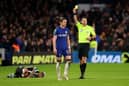 Chelsea midfielder Conor Gallagher is shown a yellow card by referee Jarred Gillett against Newcastle United. (Photo by Julian Finney/Getty Images)