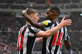 Anthony Gordon of Newcastle United celebrates scoring his team's second goal with teammate Alexander Isak during the Premier League match between Newcastle United and Wolverhampton Wanderers at St. James Park on March 02, 2024 in Newcastle upon Tyne, England. (Photo by Stu Forster/Getty Images)