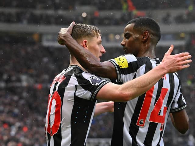 Anthony Gordon of Newcastle United celebrates scoring his team's second goal with teammate Alexander Isak during the Premier League match between Newcastle United and Wolverhampton Wanderers at St. James Park on March 02, 2024 in Newcastle upon Tyne, England. (Photo by Stu Forster/Getty Images)