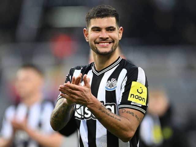 Newcastle United's Brazilian midfielder #39 Bruno Guimaraes applauds the fans following the English Premier League football match between Newcastle United and Wolverhampton Wanderers at St James' Park in Newcastle-upon-Tyne, north east England on March 2, 2024. Newcastle won the match 3-0. (Photo by Oli SCARFF / AFP)