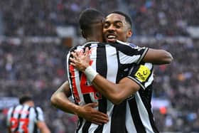Newcastle United player Alexander Isak celebrates after scoring the first Newcastle goal with team mates Joe Willock during the Premier League match between Newcastle United and Wolverhampton Wanderers at St. James Park on March 02, 2024 in Newcastle upon Tyne, England. (Photo by Stu Forster/Getty Images)