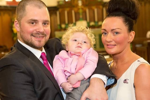 Parents Chris and Sarah Cookson with Charlie