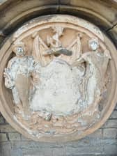 The Coat of Arms is located at the front of The Customs House building.