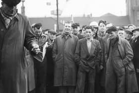 A shipyard strike in 1957. Is there someone you know in this photo?
